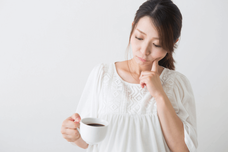 pregnant mum considering drinking coffee