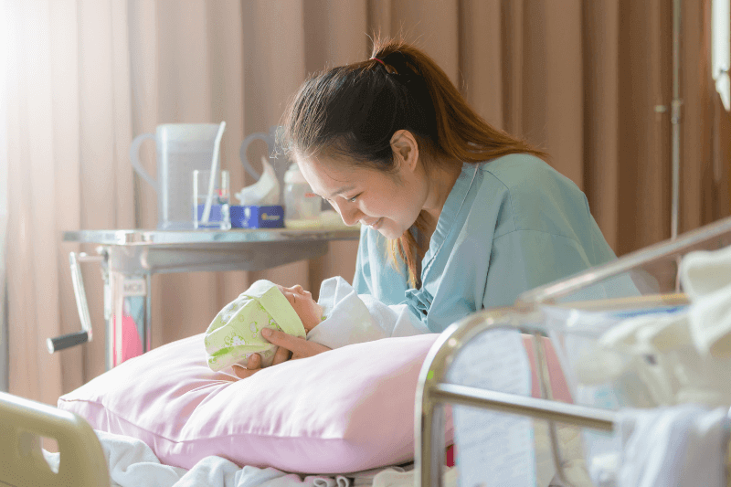 mum hugging newborn