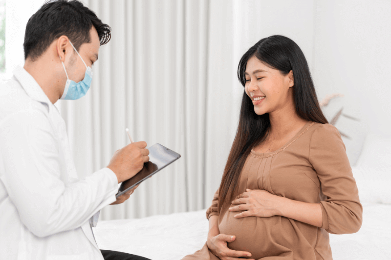 pregnant mum discussing with doctor