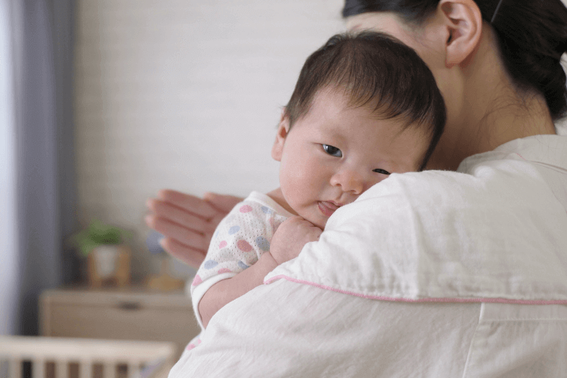 mum helping baby burp