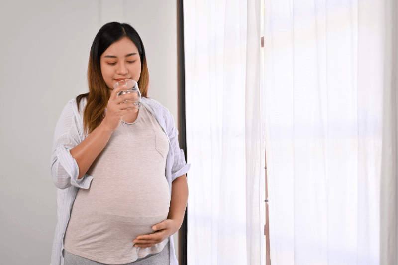 pregnant mum drinking water