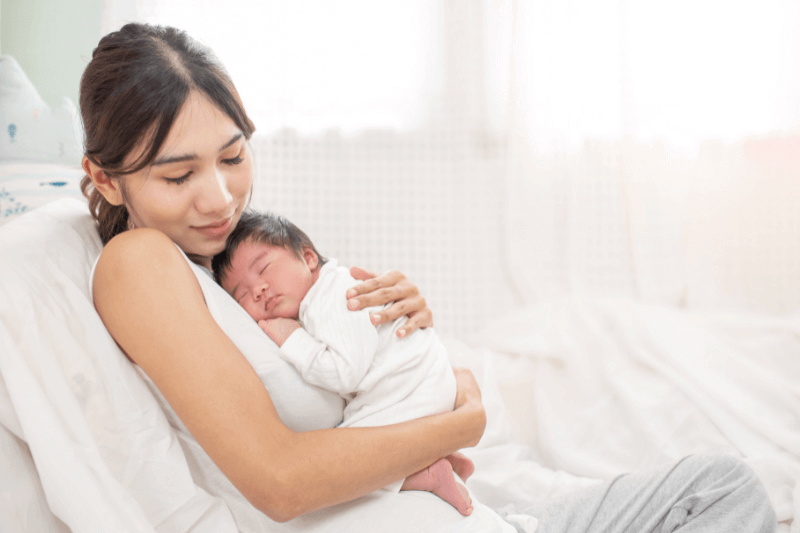 mum holding baby