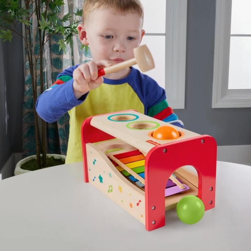 toddler playing wooden toys Fisher Price