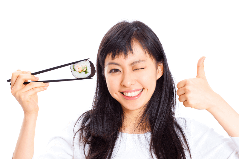 woman enjoying sushi