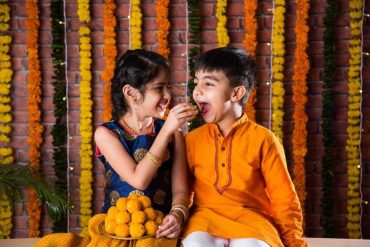 sibling celebrating Deepavali