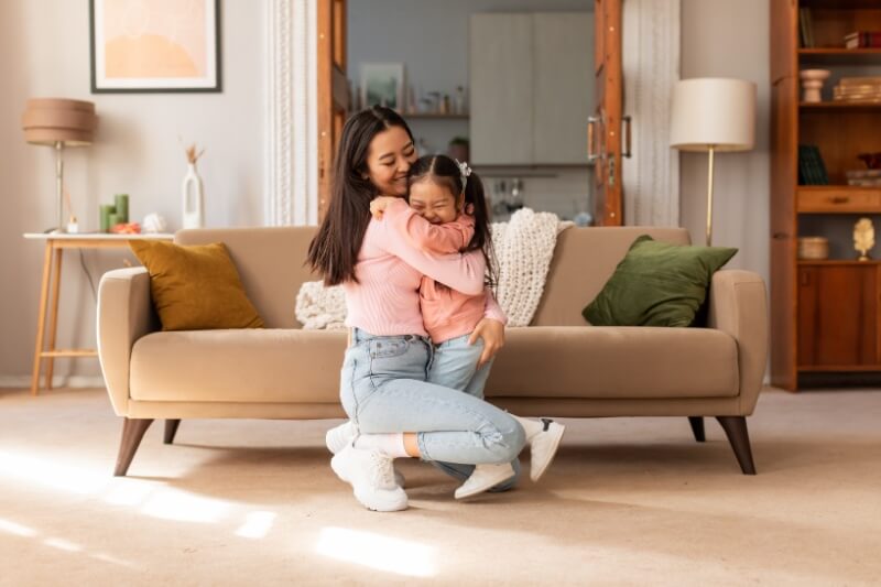 mother and daughter hugging 