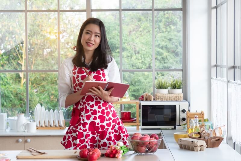 woman making meal preparation in kitchen