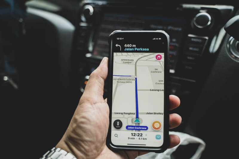 driver checking waze on phone