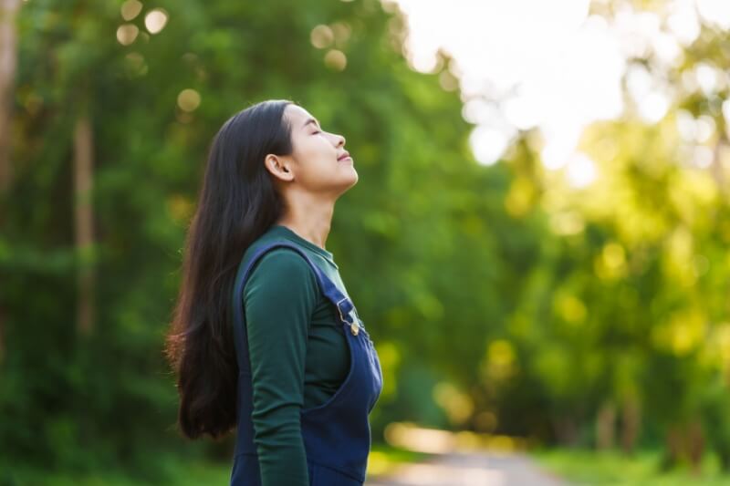 woman enjoying self care and fresh air