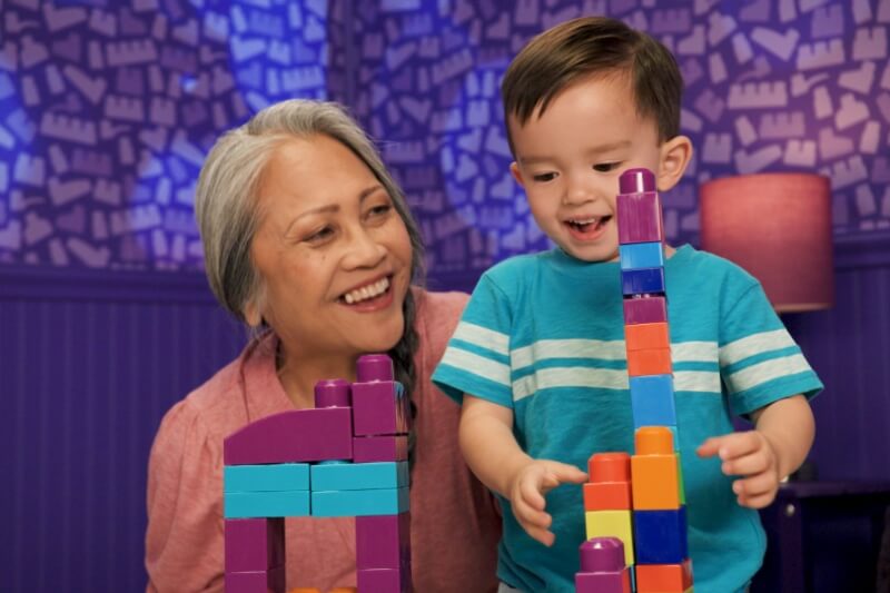 toddler playing mega bloks from mattel