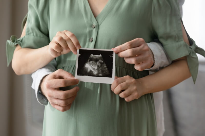 married couple holding ultrasound