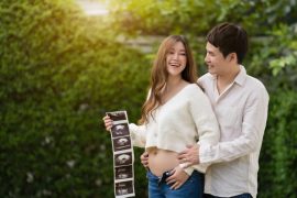 couple holding pregnancy ultrasound