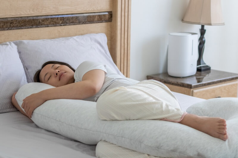 pregnant woman resting pregnancy pillow