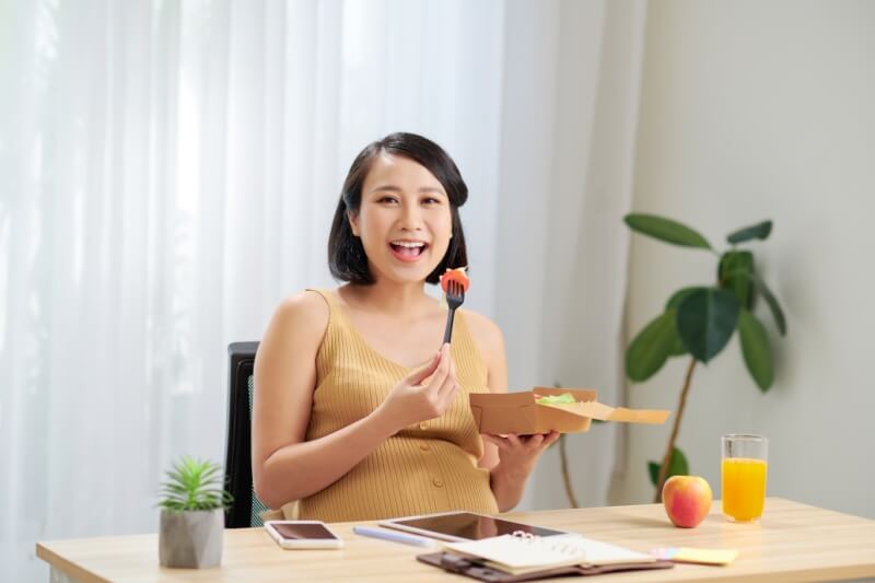 pregnant woman enjoying meals