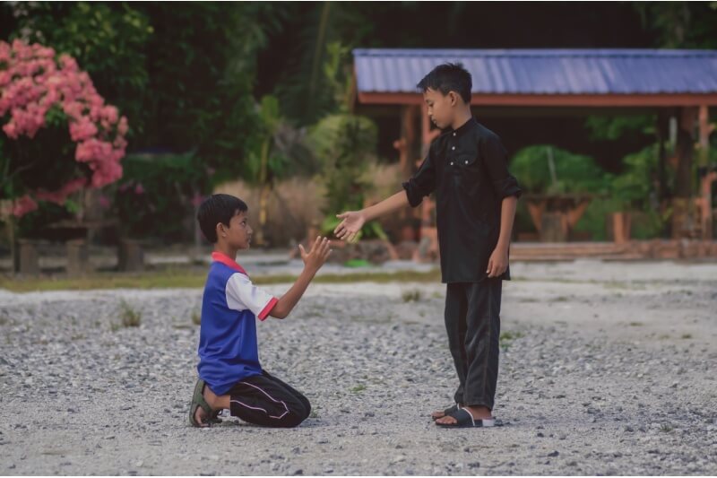 boys helping each other