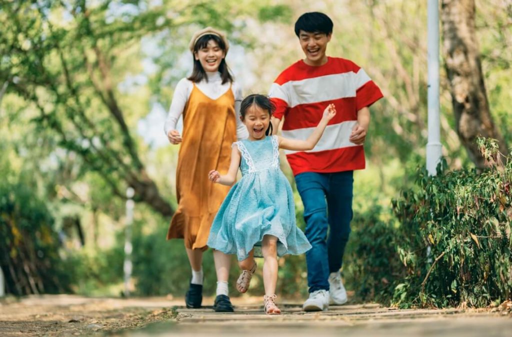 family at the park enjoying outdoor time