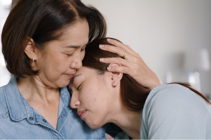 young girl and mother support system