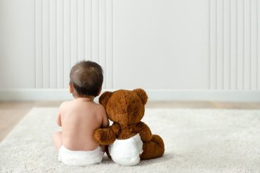 baby with teddy bear