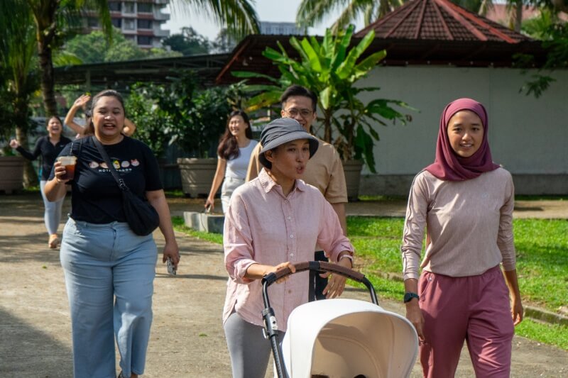 woman walking with stroller