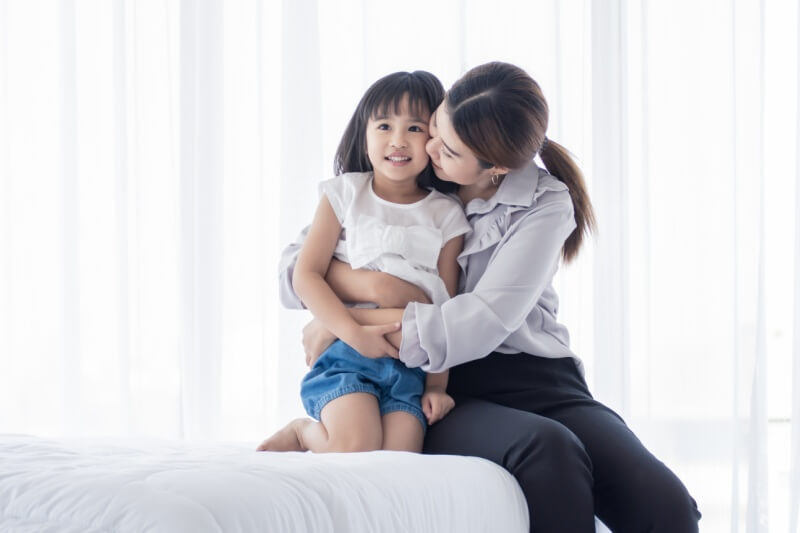 mother and daughter hugging