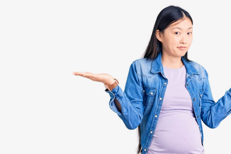 pregnant woman weighing consequences