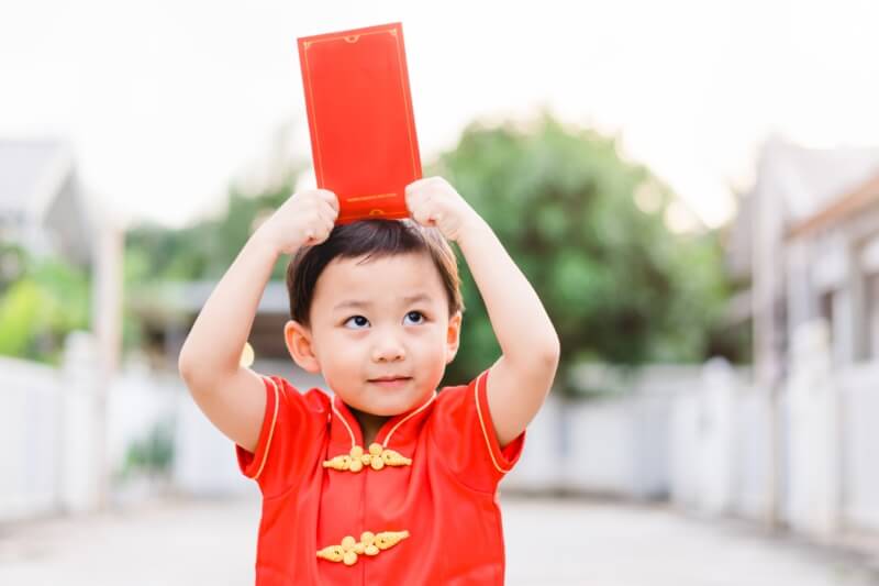 .Asian toddler boy wearing chinese traditional cheongsam