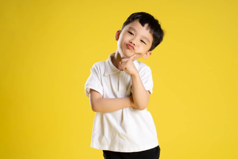  boy posing on a yellow background