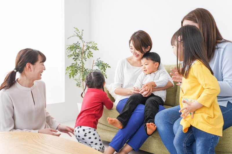 Mom friends and children at playgroup