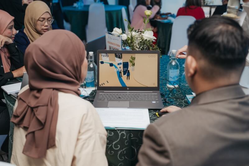 headshot of two people using an immersive laptop experience