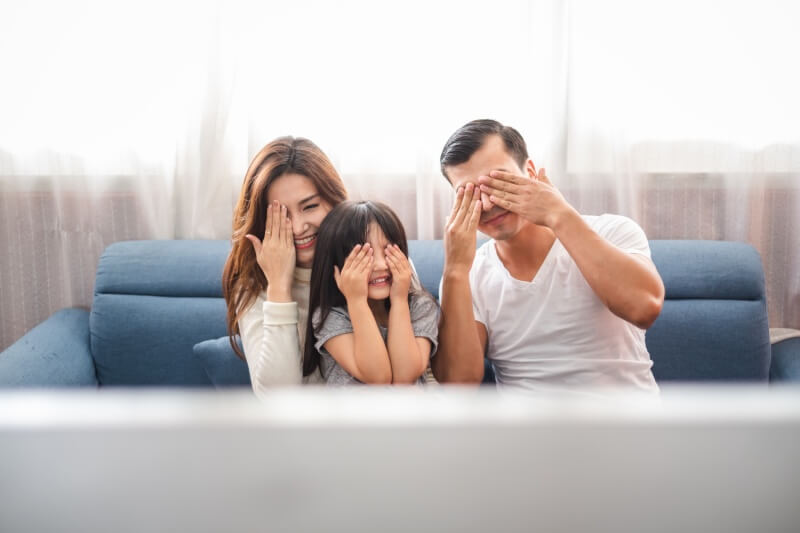 family enjoying movies at home