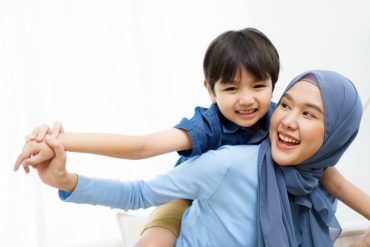 mother and son playing together