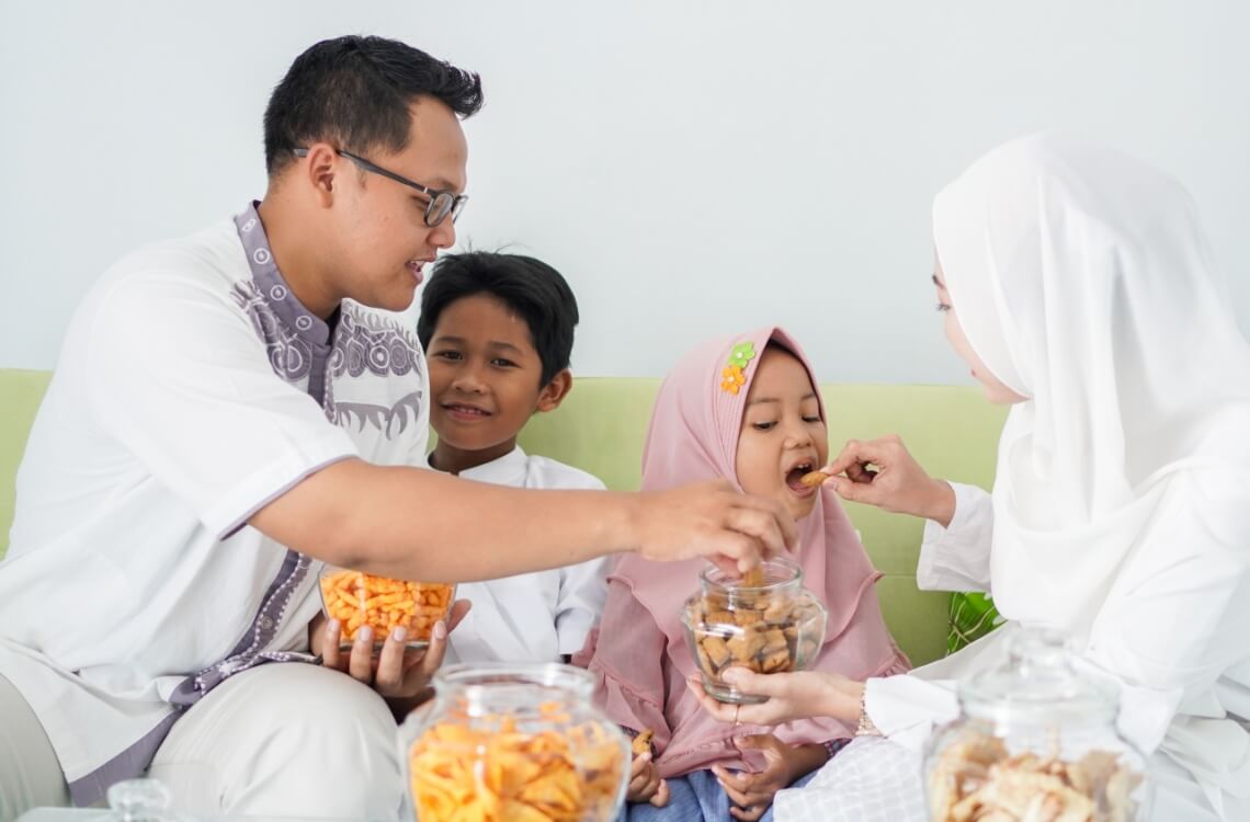 family enjoying raya cookies together