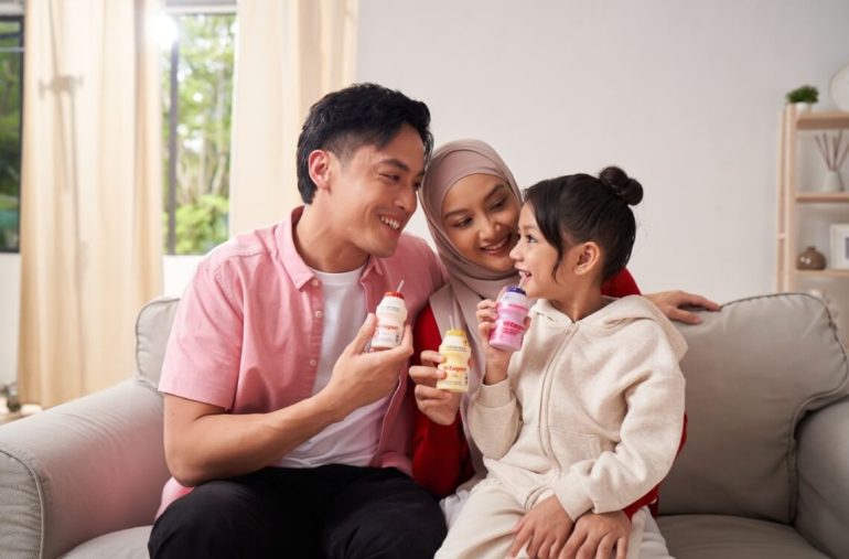 family drinking vitagen probiotic drink for gut health