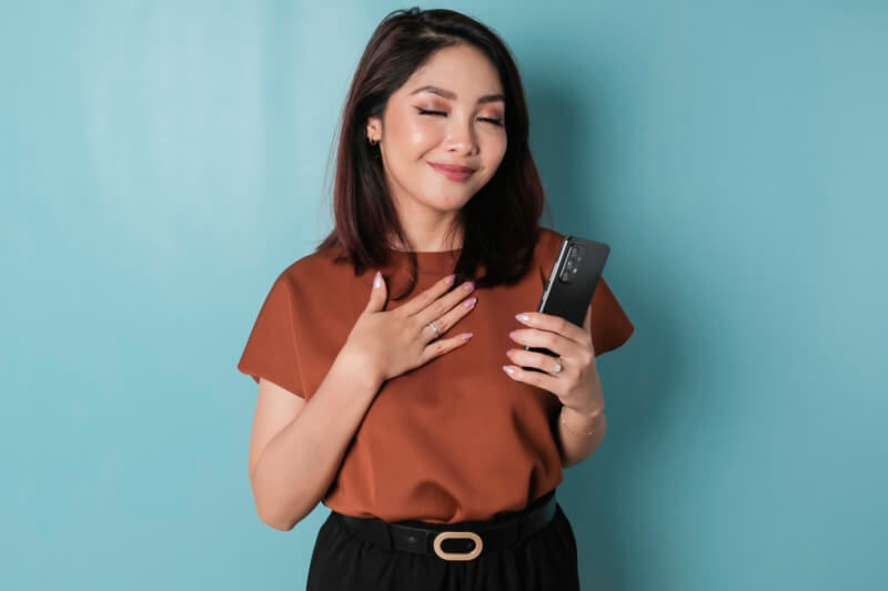 woman looking at phone looking calm