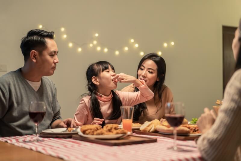 family having meals at the dining table