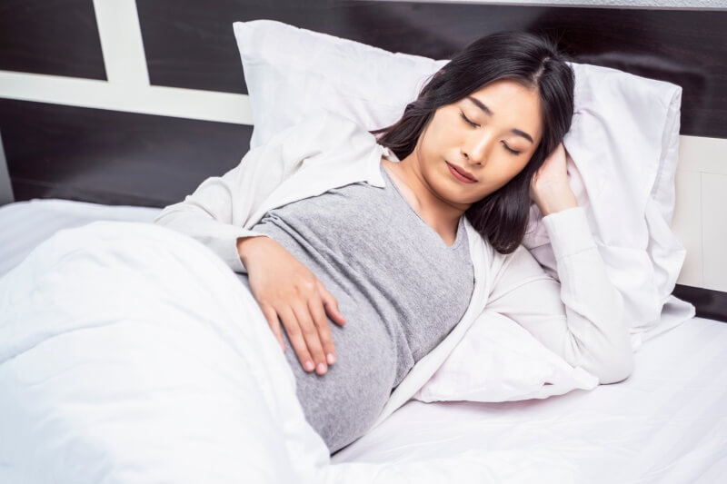 pregnant woman resting pregnancy pillow