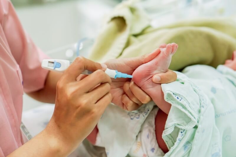 hypoglycemia infant feet checking glucose level