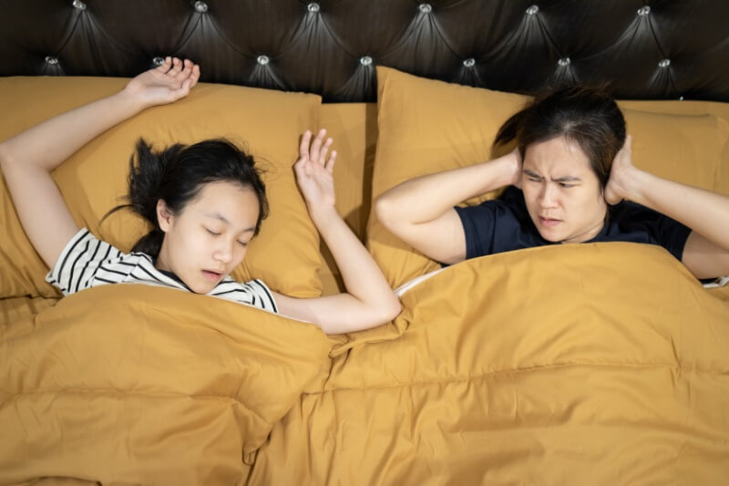 teenager struggling with bruxisim during sleep