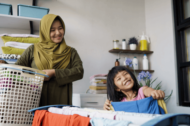 lady and child doing laundry 