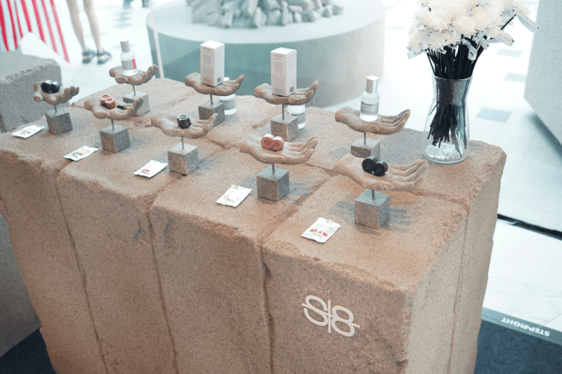 image of perfumes placed on display at gallery