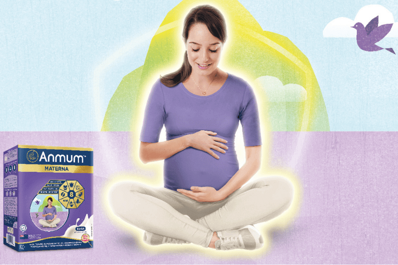 pregnant woman holding tummy wearing purple shirt advertising for anmum materna