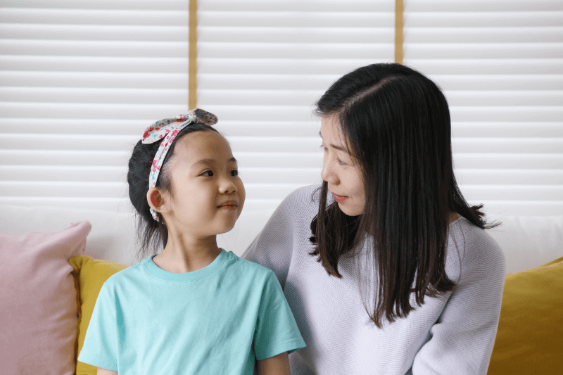 mum and daughter speaking to each other discussing 