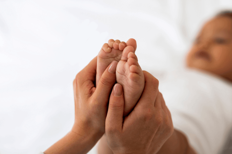 infant feet massage