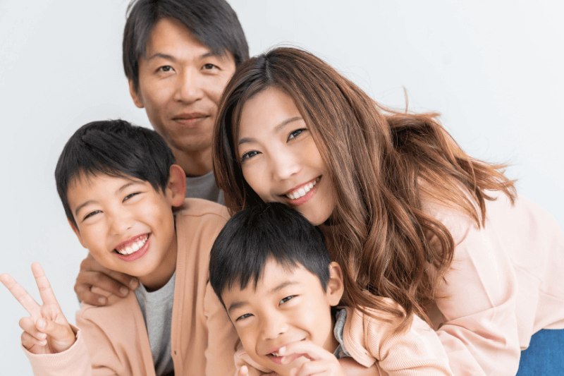 asian Family who is relaxed and feeling happy