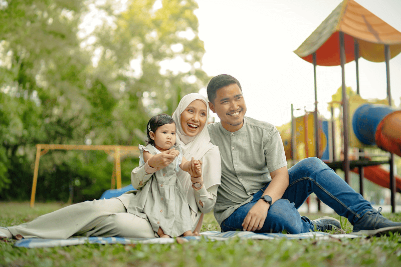 malay family at the playground outdoor park