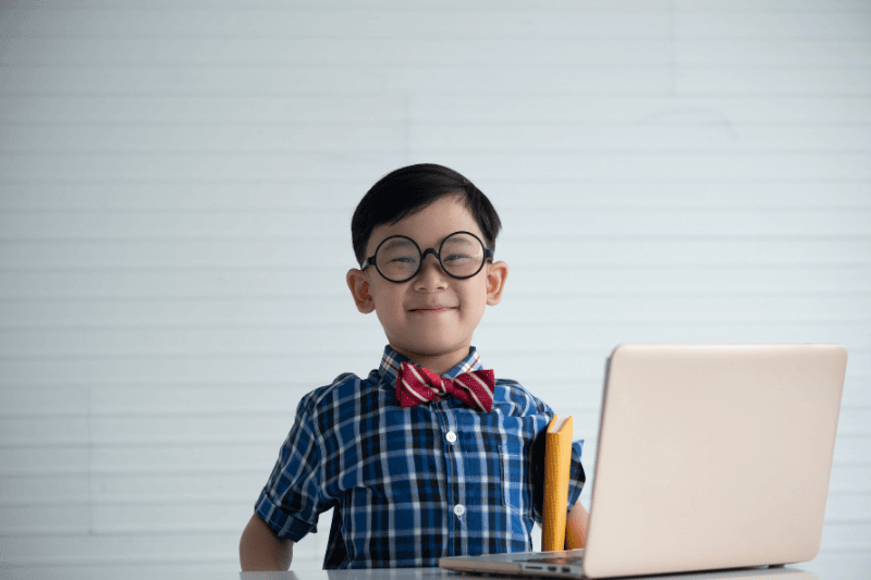 Portrait of a boy in classroom, education concept