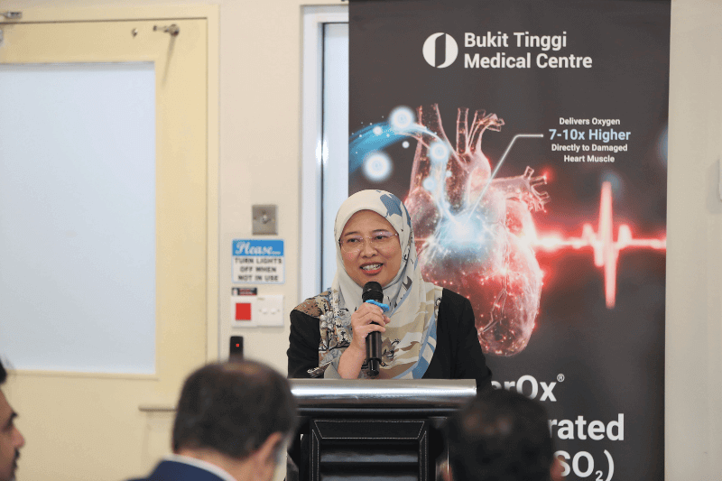 woman standing on podium giving a speech