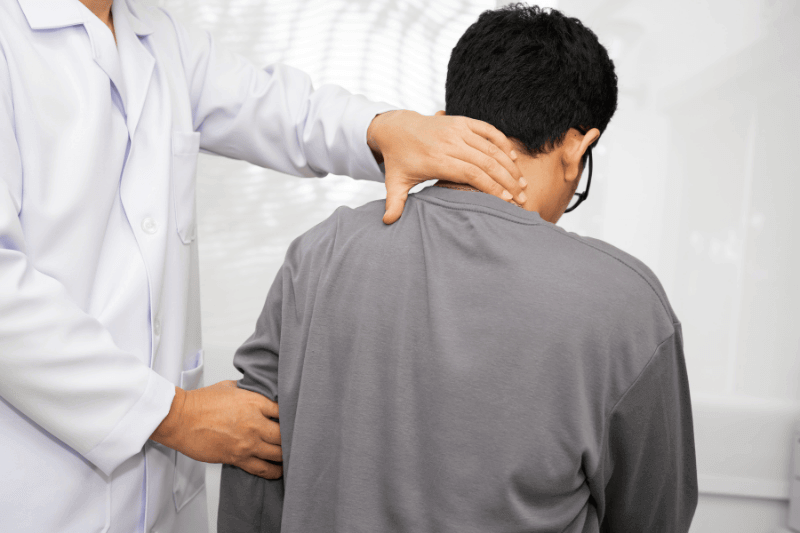 Physical therapy, Asian therapist doctor treat perform pain young man in hospital.