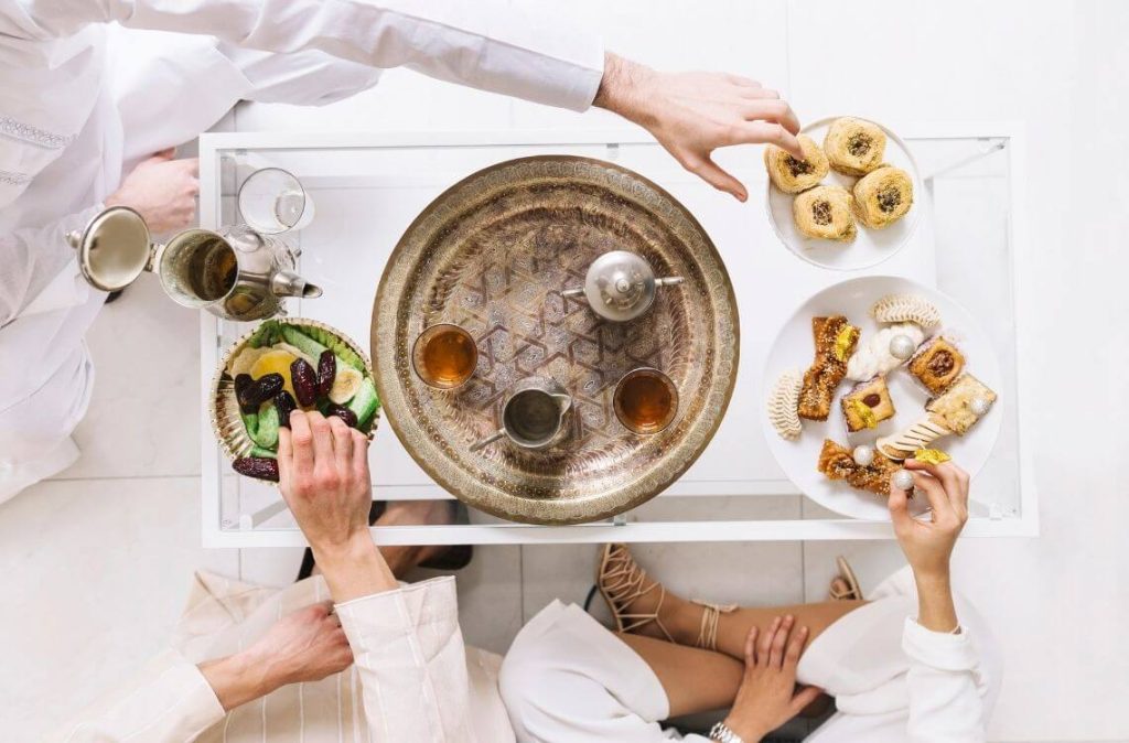 top view of people enjoying dates during iftar during ramadan