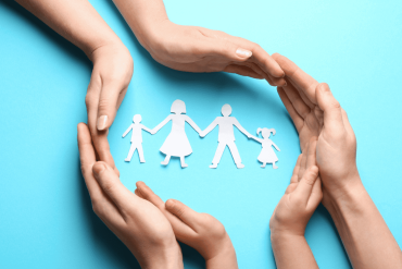 cutouts of family visual on blue background